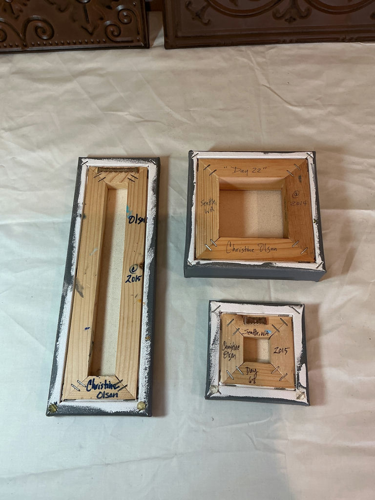 Decorative embossed metal tiles and small painted canvas artwork. - image 3 of 5