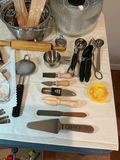 Assorted kitchen utensils, bakeware, and waffle maker. - thumbnail 2 of 5