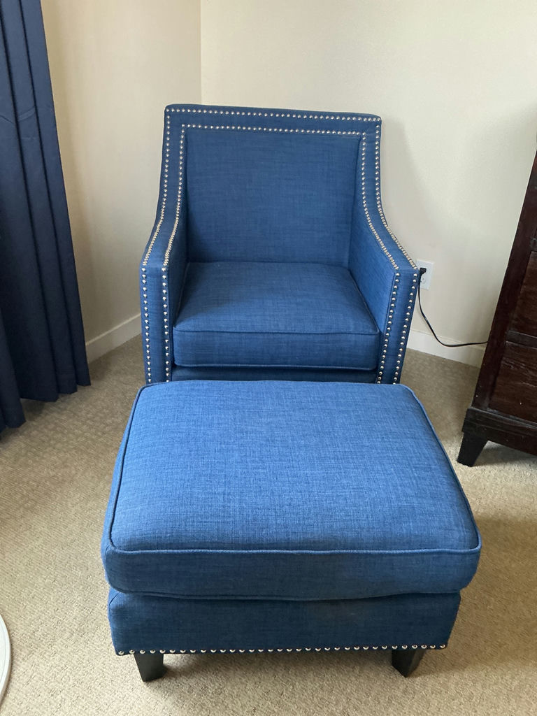 Blue fabric armchair featuring nailhead trim and matching ottoman. - image 1 of 5