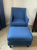 Blue fabric armchair featuring nailhead trim and matching ottoman. - thumbnail 1 of 5