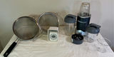 NutriBullet blender with cups and lids, mesh strainers, measuring beaker, and kitchen scale - thumbnail 1 of 3