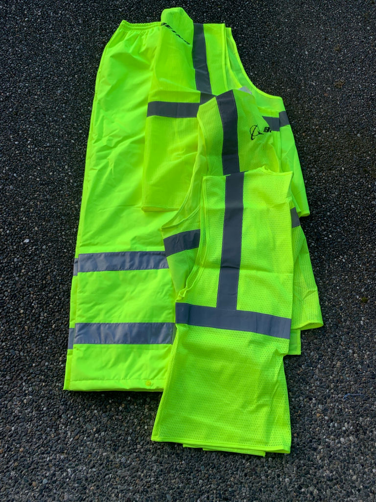Cycling gear set with helmets, hydration packs, and high-visibility vests - image 7 of 7
