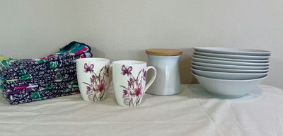 Floral Mugs, Bowls, Canister, and Folded Textiles - Image 1 of 3