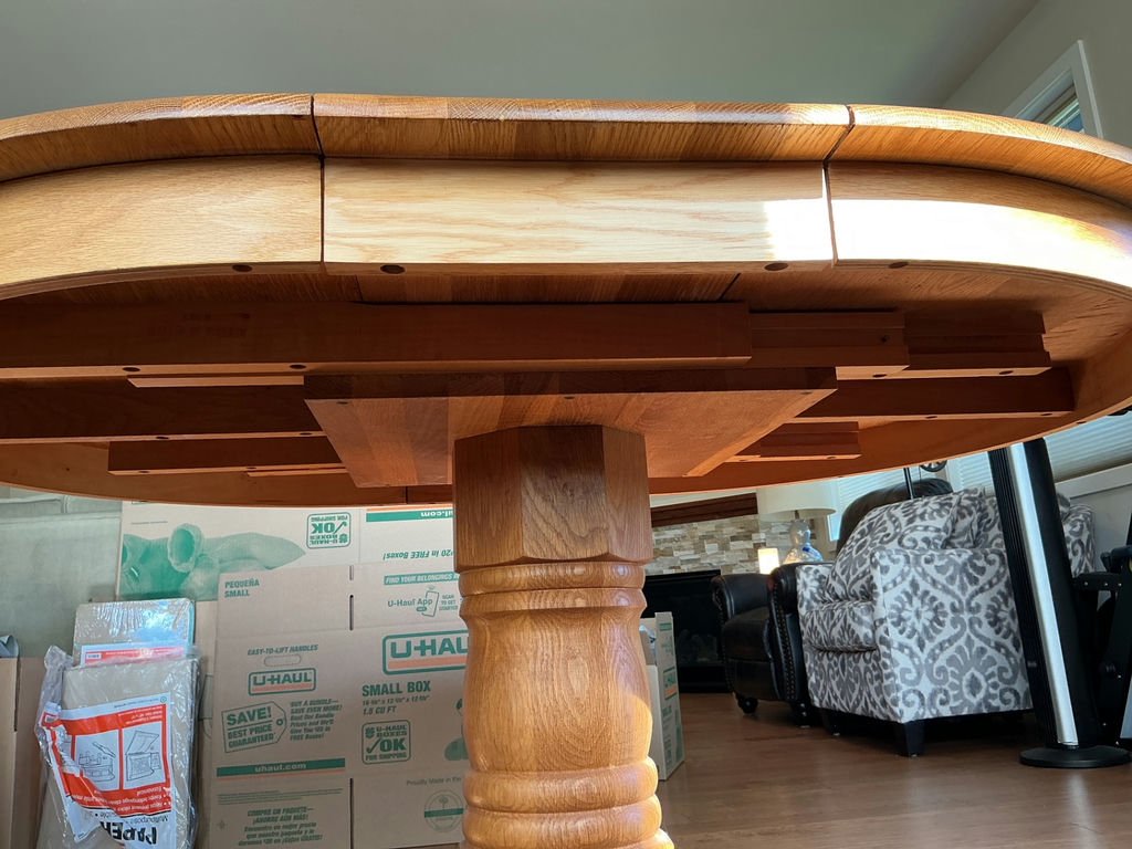 Round wooden dining table with pedestal base and four upholstered chairs - image 4 of 5
