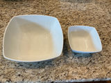Four white ceramic serving bowls in varying sizes. - thumbnail 2 of 4
