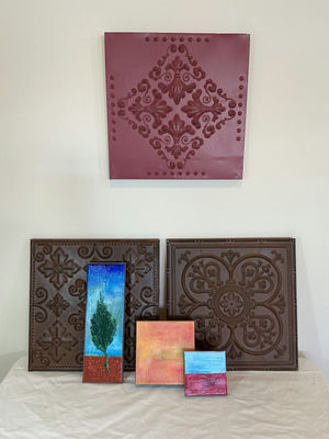 Decorative embossed metal tiles and small painted canvas artwork.  - Image 1 of 5