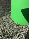 Two brown woven outdoor chairs with a green round metal side table - thumbnail 3 of 4
