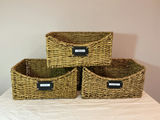 Three woven pantry storage baskets. - thumbnail 1 of 4