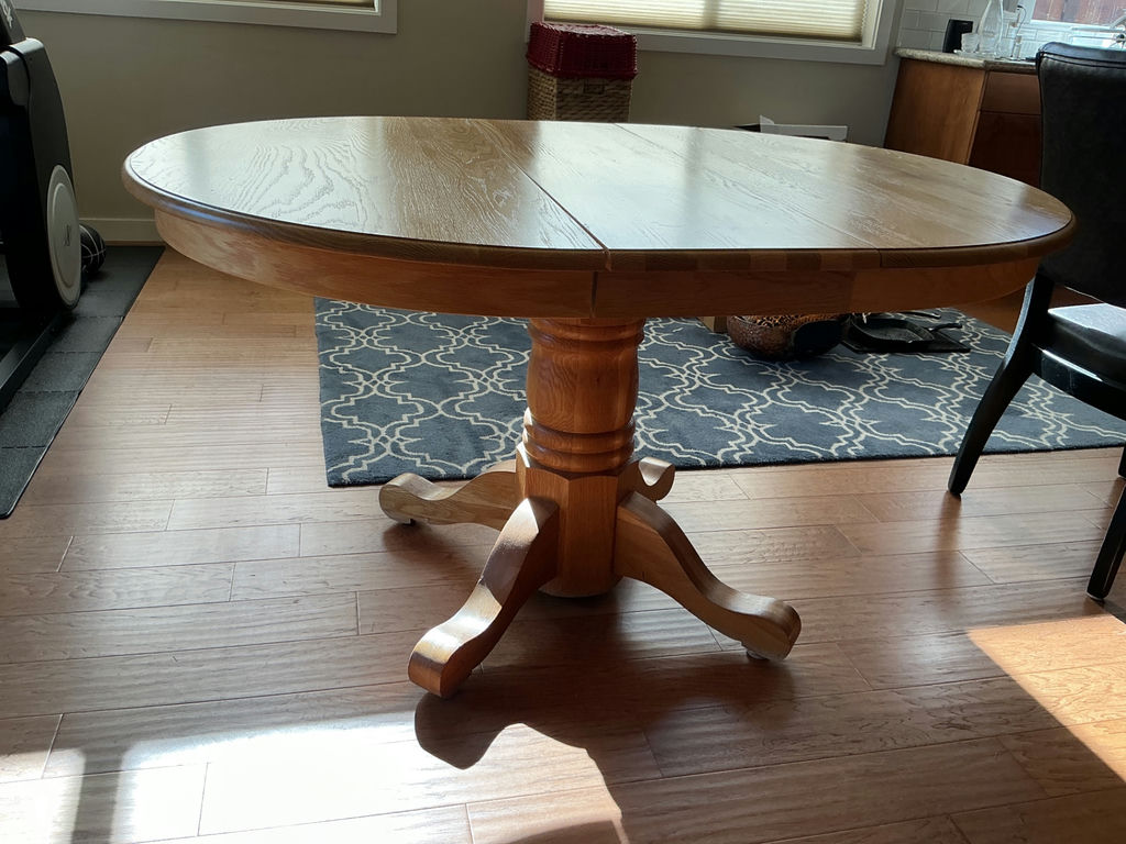 Round wooden dining table with pedestal base and four upholstered chairs - image 3 of 5