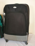 Three pieces of luggage: two rolling suitcases and a backpack - thumbnail 2 of 8