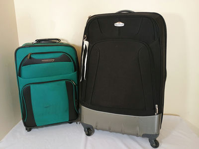 Three pieces of luggage: two rolling suitcases and a backpack - Image 1 of 8