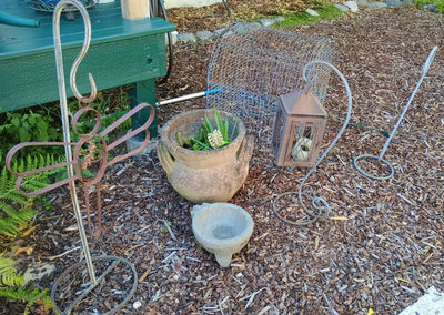 Outdoor garden decor: lantern, bird cage, metal cross and planters - Image 1 of 5