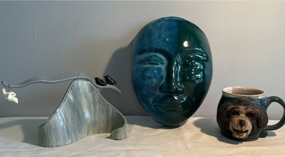 Ceramic art collection: blue-green face sculpture, monkey-mug, and abstract forms - Image 1 of 8