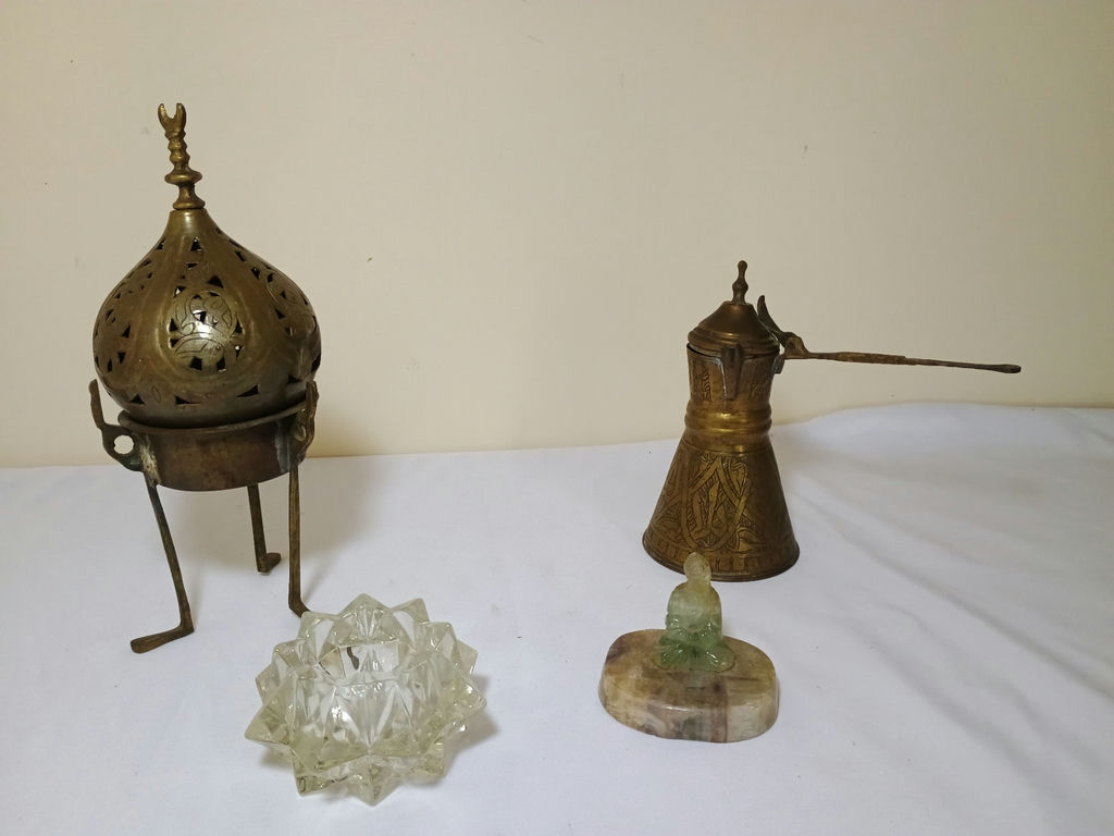Brass incense censer, brass oil can, glass star sculpture, and jade Buddha figurine - image 1 of 6