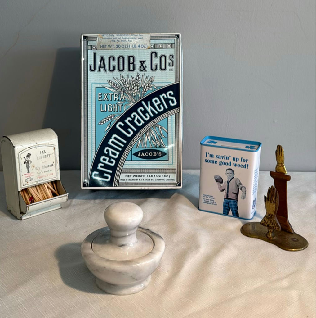 Vintage marble pestle and mortar, brass hands candle holder, match dispenser, and cracker packaging - image 1 of 9