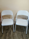 Two white metal folding chairs - thumbnail 1 of 3