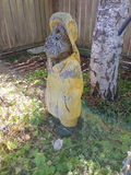 Weathered yellow wooden statue yard art - thumbnail 2 of 3