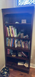 Wooden Bookshelf with Books and Decorative Items - thumbnail 1 of 15