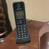 Panasonic Cordless Phone, Timex Clock Radio, Carousel Horse Figurine, Leather Holders, and Power Strip - thumbnail 3 of 6