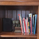 Books, Elephant Figurines, and Speaker on Wooden Bookshelf - thumbnail 2 of 17