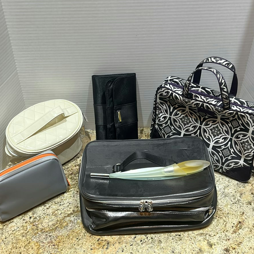 Assorted Cosmetic and Travel Bags with Fragrance Bottle - image 1 of 13