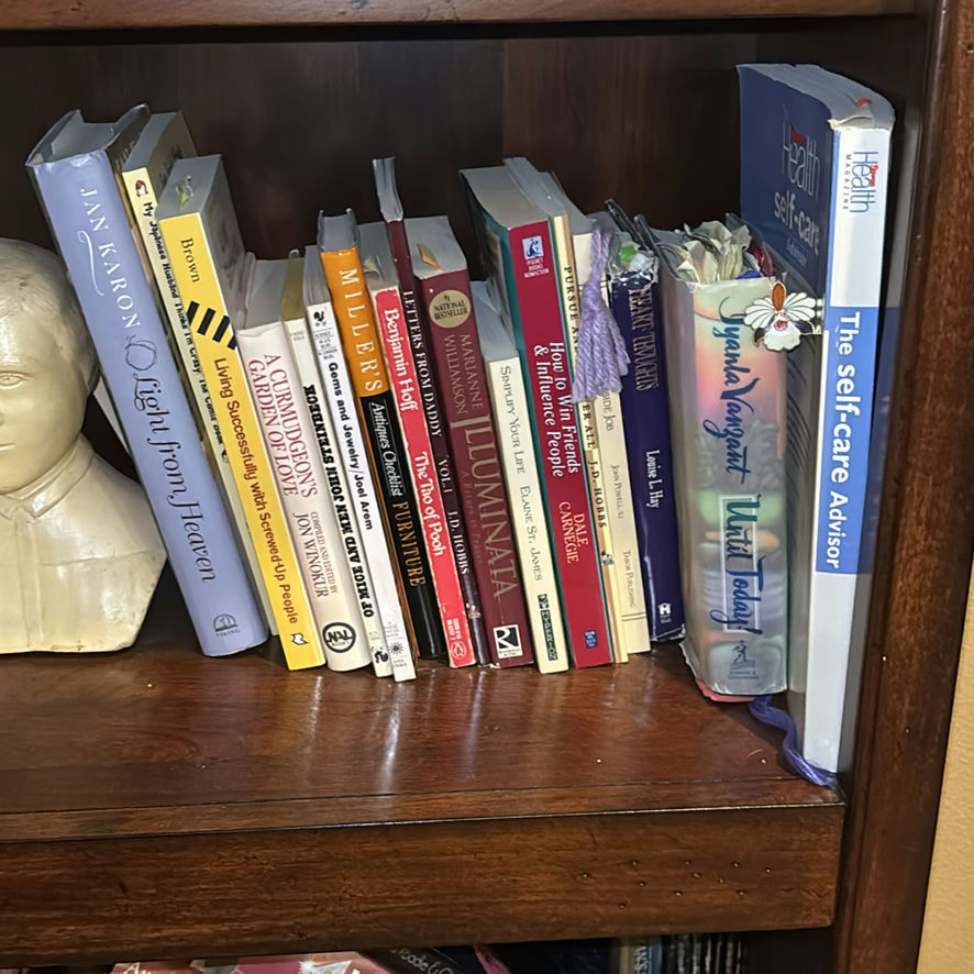 Wooden Bookshelf with Books and Decorative Items - image 5 of 15
