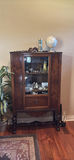 Wooden Curio Cabinet with Decorative Globe and Glass Cylinder Decor - thumbnail 1 of 7