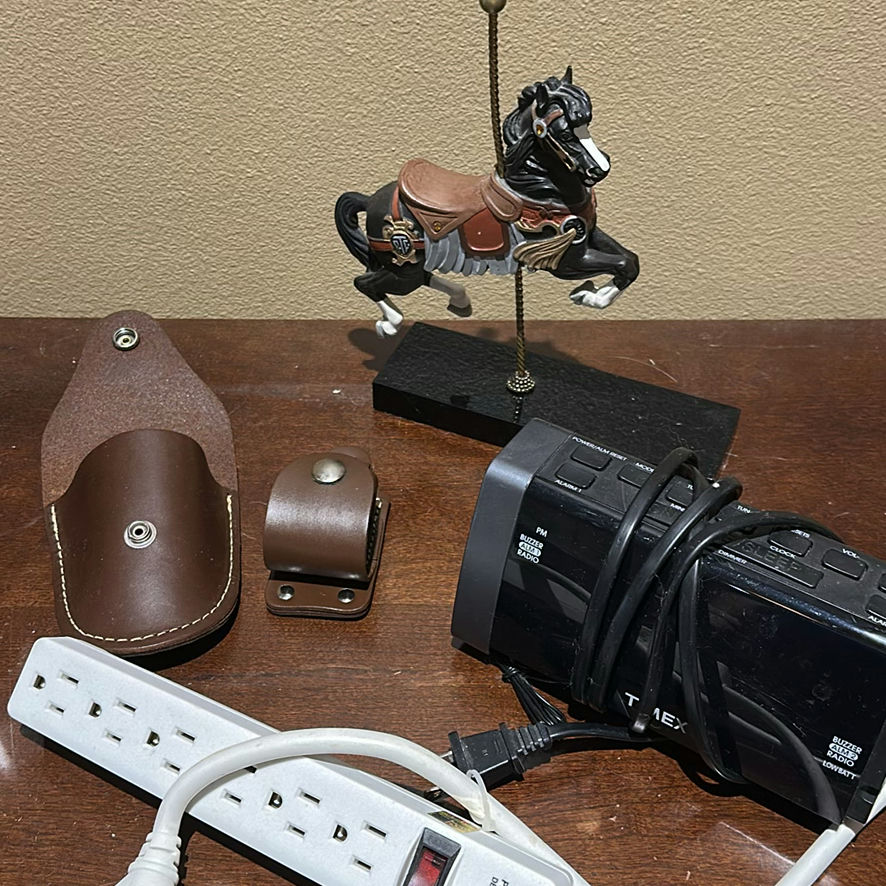 Panasonic Cordless Phone, Timex Clock Radio, Carousel Horse Figurine, Leather Holders, and Power Strip - image 1 of 6
