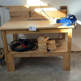 Wood Workbench with Bench Vise and Lumber - thumbnail 1 of 9