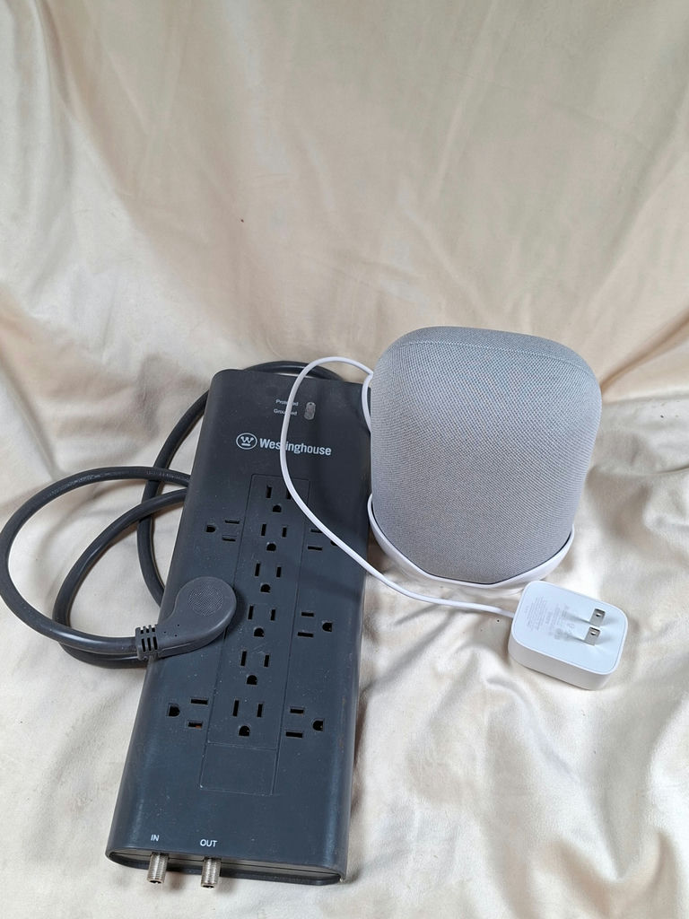 Westinghouse power strip with multiple outlets and a gray fabric-covered speaker - image 2 of 4