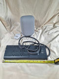 Westinghouse power strip with multiple outlets and a gray fabric-covered speaker - thumbnail 1 of 4