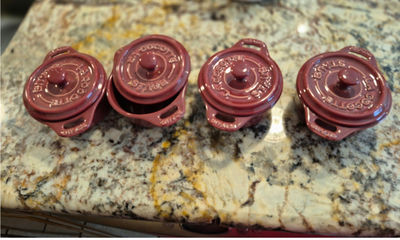 Set of four Staub burgundy ceramic cocottes with lids - Image 1 of 1
