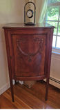 Antique curved-front wooden cabinet with carved panel - thumbnail 2 of 3