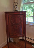 Antique curved-front wooden cabinet with carved panel - thumbnail 1 of 3