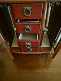 Small wooden jewelry armoire with mirrored doors and five drawers - thumbnail 2 of 3