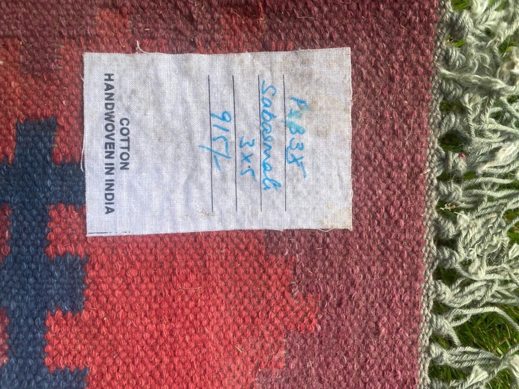 Handwoven cotton rug with geometric red and blue pattern - image 3 of 5