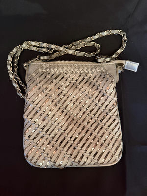 Woven crossbody pouch with a chain strap - Image 1 of 5