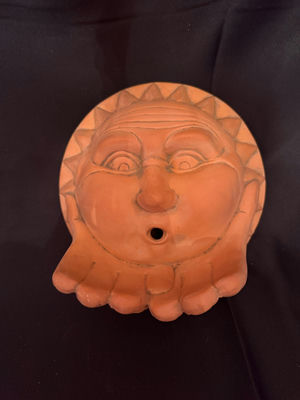 Terracotta sun face wall hanging/bird feeder - Image 1 of 3