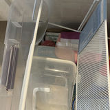 Clear plastic storage tote with cleaning supplies and miscellaneous items - thumbnail 4 of 4
