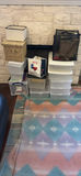 Stacked plastic storage boxes with baskets and organizers - thumbnail 1 of 5