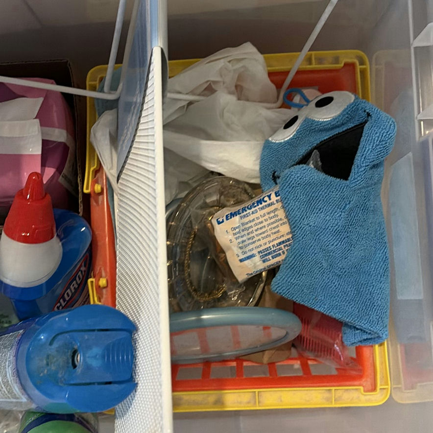 Clear plastic storage tote with cleaning supplies and miscellaneous items - image 2 of 4