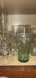 Assorted glassware and mugs on cabinet shelf - thumbnail 5 of 5