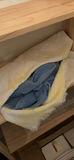 Wooden open-shelf storage with linens and decor items - thumbnail 2 of 5