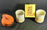 Yixing-style brown teapot with two cups and yellow box - thumbnail 1 of 8