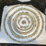 Assorted Ceramic Dishware with Floral Plates, Cups, and Decorative Bowls - thumbnail 2 of 14