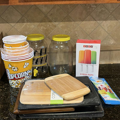 Kitchenware assortment: bamboo cutting boards, glass jars, popcorn tub, and ice pop molds - Image 1 of 6