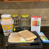 Kitchenware assortment: bamboo cutting boards, glass jars, popcorn tub, and ice pop molds - thumbnail 1 of 6
