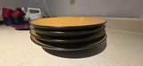 Stack of yellow-inside, black-outside bowls with kitchenware and tea box - thumbnail 4 of 8