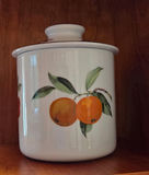Wicker baskets, fruit-patterned canisters, and a cut-glass jar - thumbnail 3 of 6