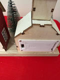 New in box - Christmas village with houses, trees, and holiday figures - thumbnail 2 of 2